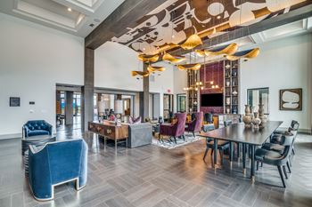 Aura avant apartments in lewisville, texas clubhouse with serving kitchen and game zone